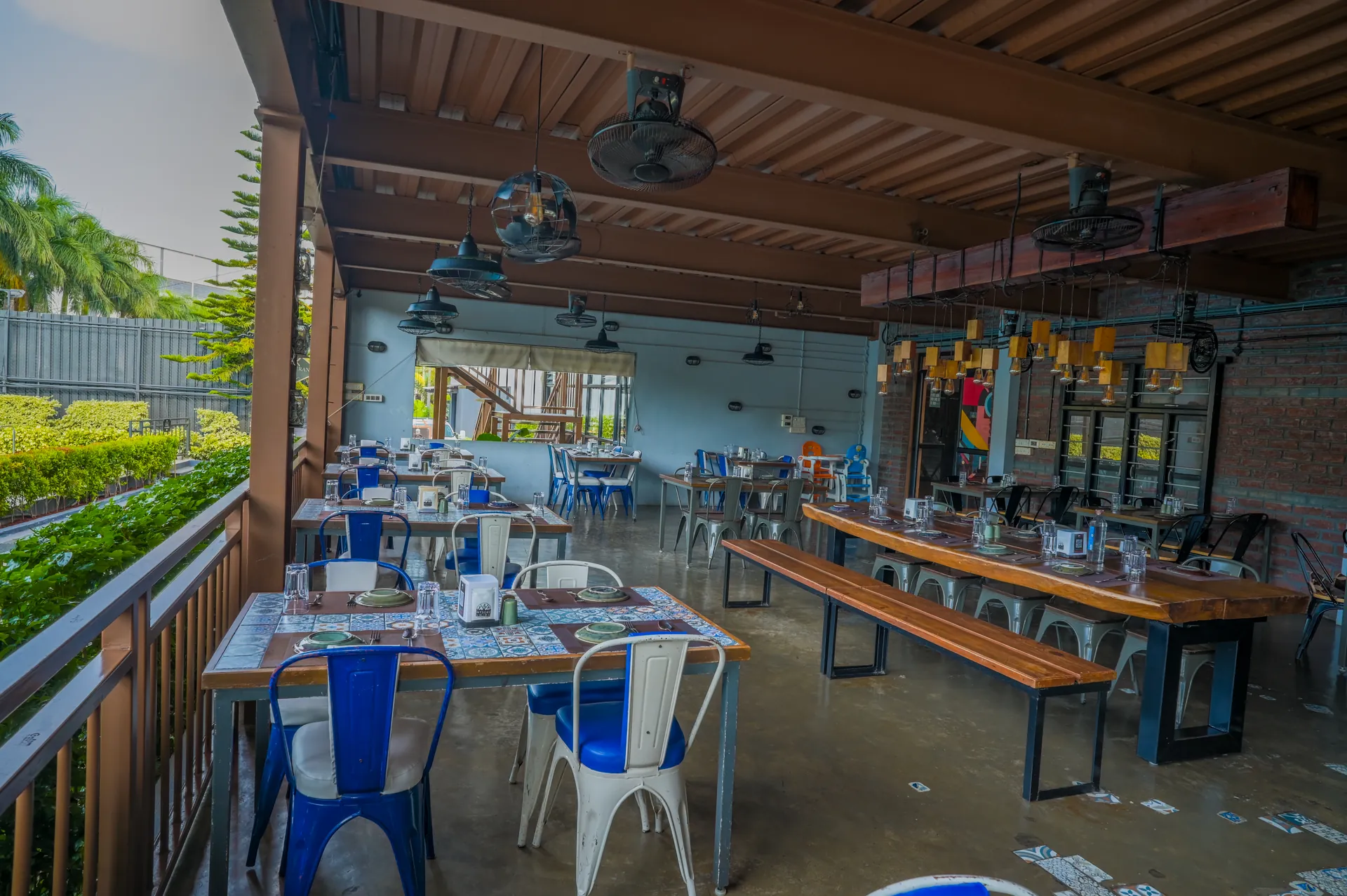 Mysore Union bar counter and dining area with hanging shelves