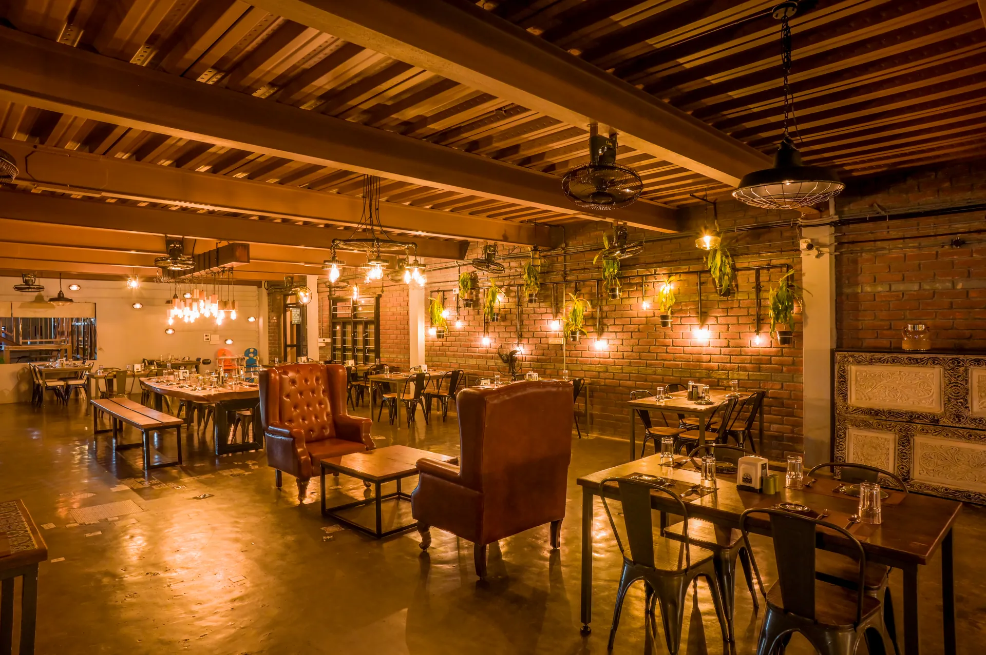 Warm interior dining and social seating at Mysore Union Mysuru