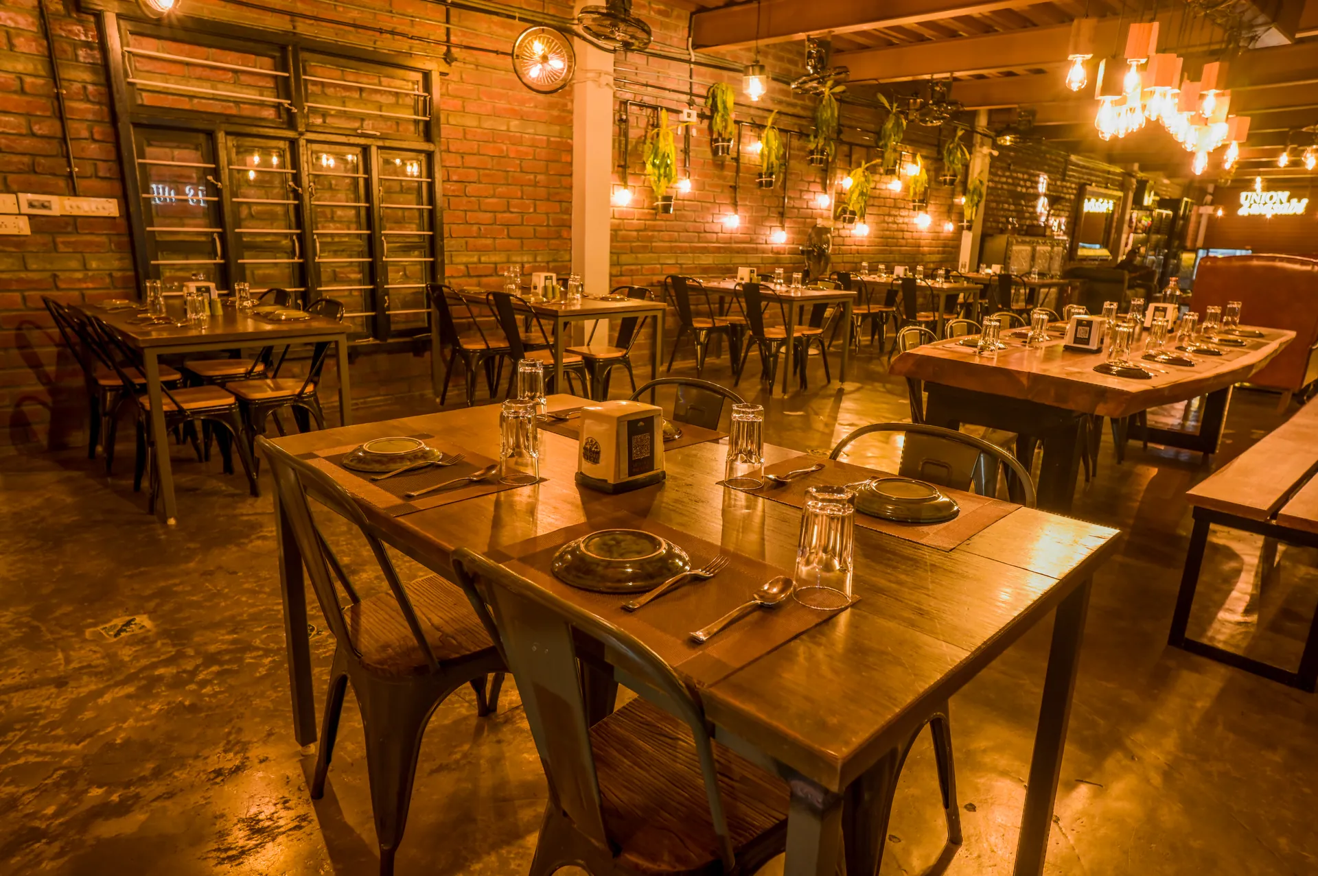 Warm rustic evening dining room at Mysore Union restaurant Mysore